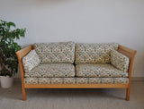 Rotang 2 seater sofa by Arne Norell. Side sections and back with woven cane