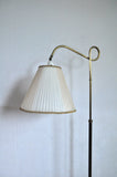 Art deco floor lamp in brass and browned brass with original shade