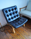 Black leather lounge chair by Farstrup Møbler. Leather upholstery in a fine condition.