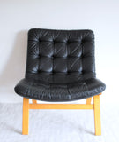 Black leather lounge chair by Farstrup Møbler. Leather upholstery in a fine condition.