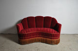 Curved 1930s sofa with original channeled back upholstery.