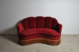 Curved 1930s sofa with original channeled back upholstery.