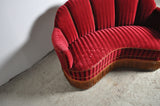 Curved 1930s sofa with original channeled back upholstery.
