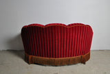 Curved 1930s sofa with original channeled back upholstery.