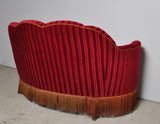 Curved 1930s sofa with original channeled back upholstery.