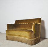 Curved Early 20th Century Sofa with original upholstery in green and yellow tones