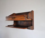 Danish Modern Wall Mounted Storage in teak and rosewood