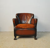 Club chair with original leather from 1920s