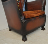 Club chair with original leather from 1920s