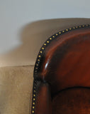 Club chair with original leather from 1920s