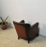 Club chair with original leather from 1920s