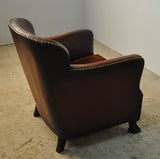 Club chair with original leather from 1920s