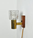 Mid-Century Modern wall light in solid teak, brass and glass shade attributed to Carl Fagerlund for Orrefors. 