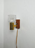 Mid-Century Modern wall light in solid teak, brass and glass shade attributed to Carl Fagerlund for Orrefors. 