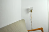 Mid-Century Modern wall light in solid teak, brass and glass shade attributed to Carl Fagerlund for Orrefors. 