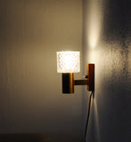 Mid-Century Modern wall light in solid teak, brass and glass shade attributed to Carl Fagerlund for Orrefors. 