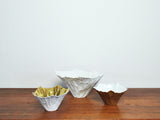 Bowls of white porcelain, partially gilded by Violise Lunn for Royal Copenhagen