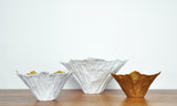 Bowls of white porcelain, partially gilded by Violise Lunn for Royal Copenhagen