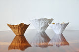 Bowls of white porcelain, partially gilded by Violise Lunn for Royal Copenhagen