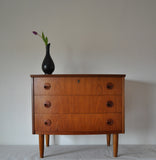 Teak chest of drawers with three drawers. 
