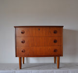 Teak chest of drawers with three drawers. 