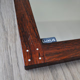 Rare swedish rosewood mirror with silver detail by Uno & Östen Kristiansson. Produced by Luxus in Vittsjö, 1960s.