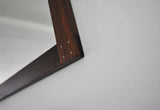 Rare swedish rosewood mirror with silver detail by Uno & Östen Kristiansson. Produced by Luxus in Vittsjö, 1960s.