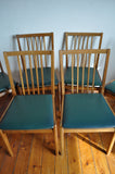 6 danish dining chairs. Oak and dark green artificial leather.