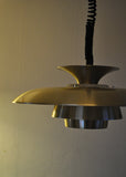A classic Danish multilayered brass pendant light