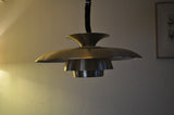 A classic Danish multilayered brass pendant light