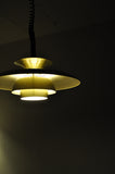 A classic Danish multilayered brass pendant light